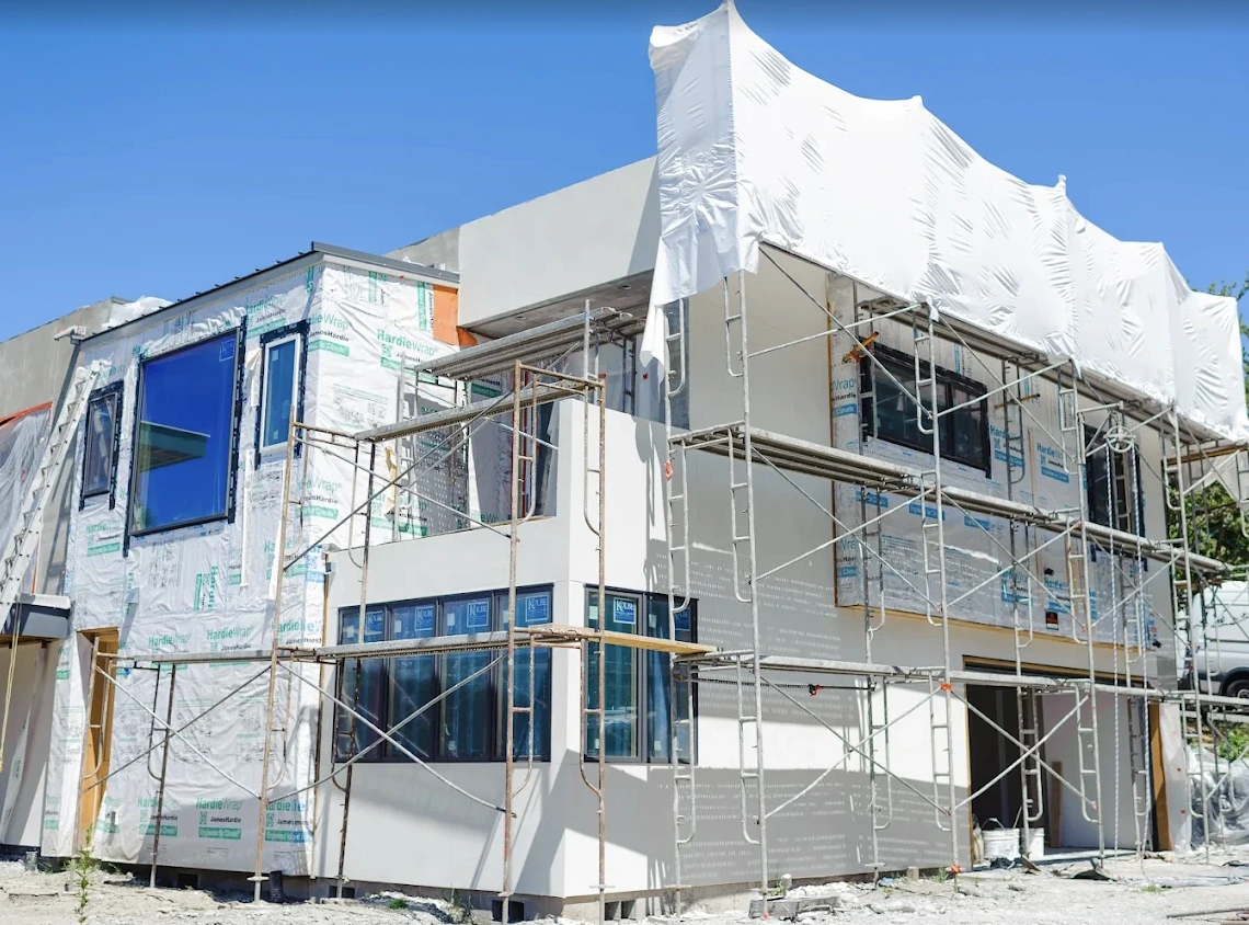 Stucco installation in progress on a residential project